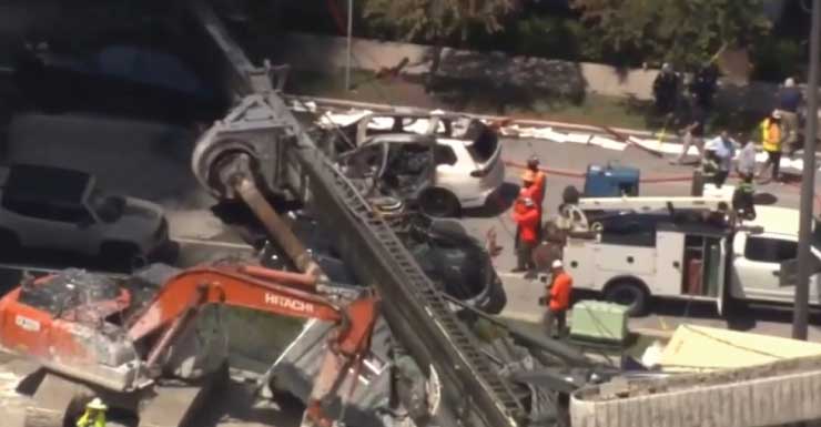 3 Trabajadores de construcción y una conductora hospitalizados después de que una plataforma de perforación colapsara sobre Brickell Bay Drive y provocara el incendio de una SUV